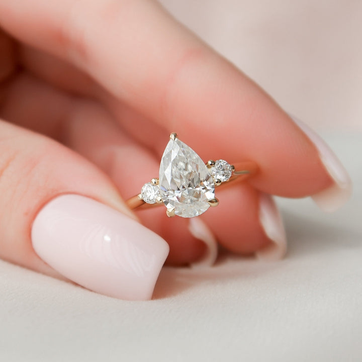 Breathtaking Pear Moissanite Anniversary Ring with Elegant Shaping