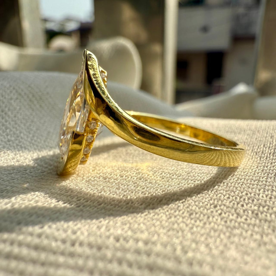 Golden Embrace Pear Cut Solitaire Ring