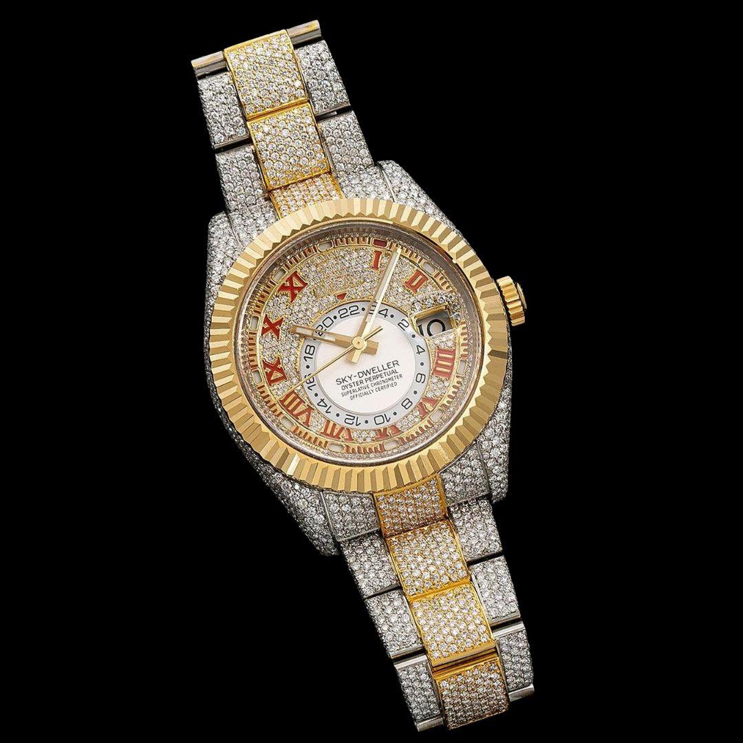 Rolex Sky-Dweller Diamond Paved Dial Red Roman Numerals Two Tone Yellow Gold Iced Out Moissanite Watch Close Up Front View