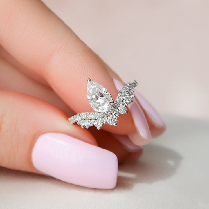Fluid Beauty Sleek-Swirls Pear Cut Diamond Ring with Unique Charm
