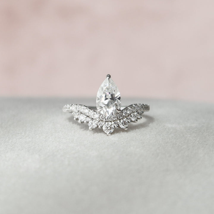 Fluid Beauty Sleek-Swirls Pear Cut Diamond Ring with Unique Charm