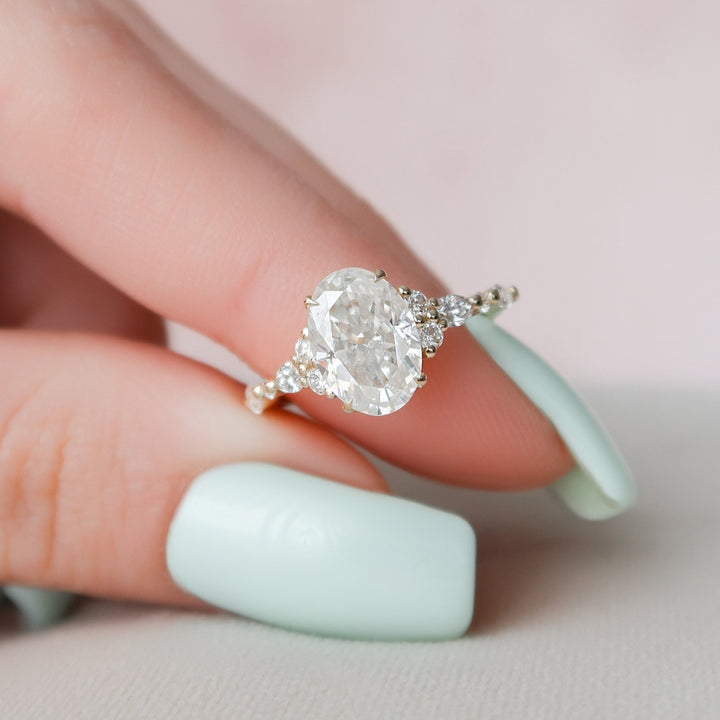 Classic Beauty 2.00 CT Moissanite Oval Cut Ring with Four-Prong Setting and Side Stone Diamonds