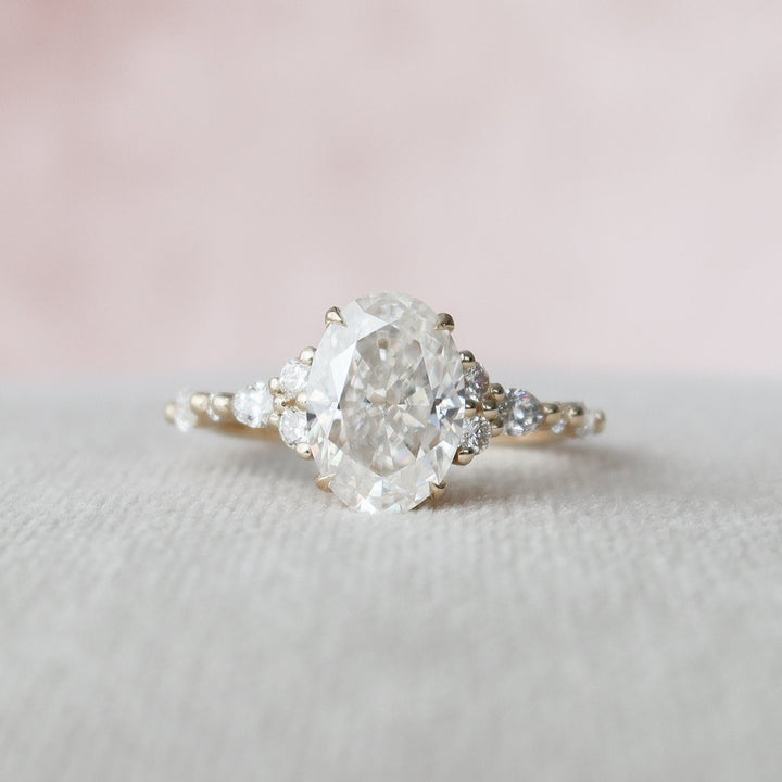 Classic Beauty 2.00 CT Moissanite Oval Cut Ring with Four-Prong Setting and Side Stone Diamonds