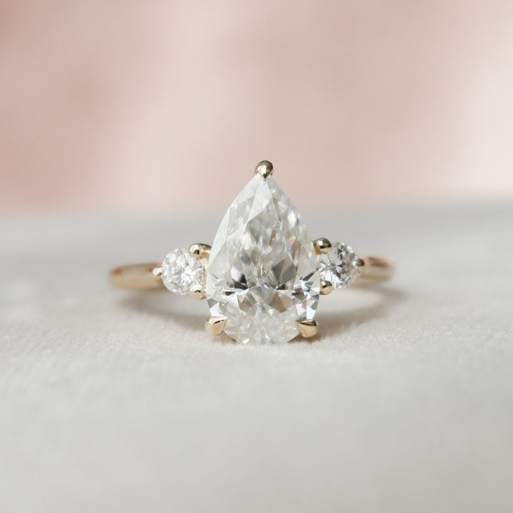 Breathtaking Pear Moissanite Anniversary Ring with Elegant Shaping