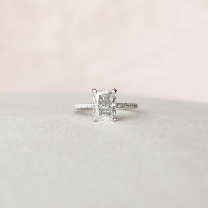 Luminous Beauty Radiant Cut Moissanite Hidden Halo Engagement Ring with Glowing Charm