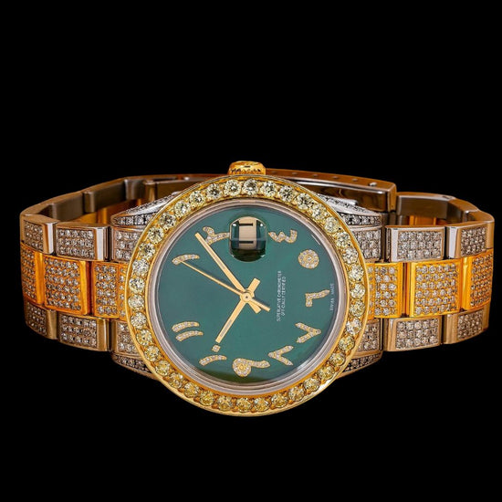 Rolex Datejust Green Dial Diamond Arabic Numerals Two Tone Yellow Gold Oyster Bracelet Iced Out Moissanite Watch Close Up Bezel View