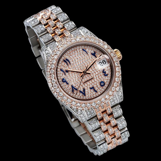 Rolex Rose Gold Diamond Paved Dial Blue Arabic Numerals Two Tone Jubilee Bracelet Iced Out Moissanite Watch Close Up Front View