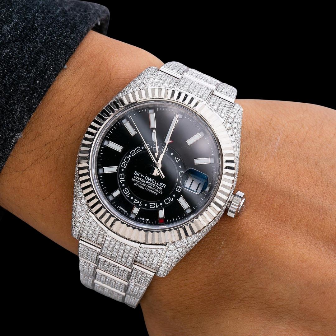 Rolex Sky-Dweller Black Dial White Stick Markers Fluted Bezel Fully Iced Out Moissanite Watch On Wrist View